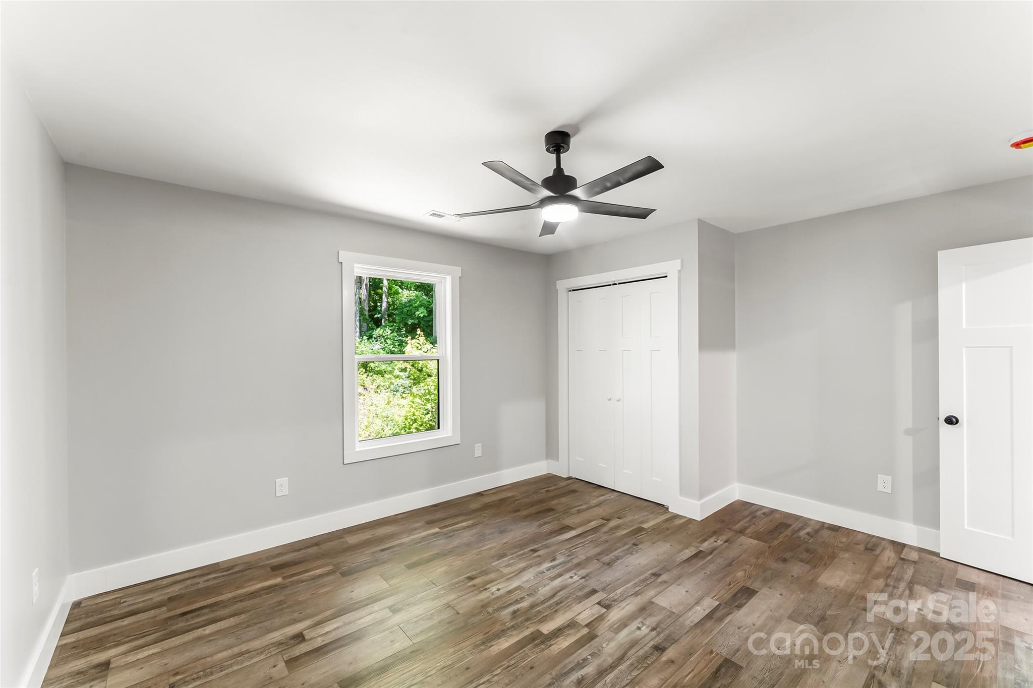 511 Blue Ridge Drive North Marion, NC 28752 - Photo 24 of 41 a view of a big room with wooden floor and a window