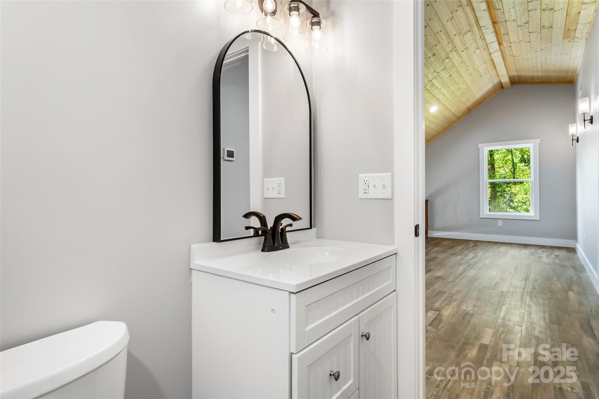 511 Blue Ridge Drive North Marion, NC 28752 - Photo 29 of 41 a bathroom with a sink and a mirror