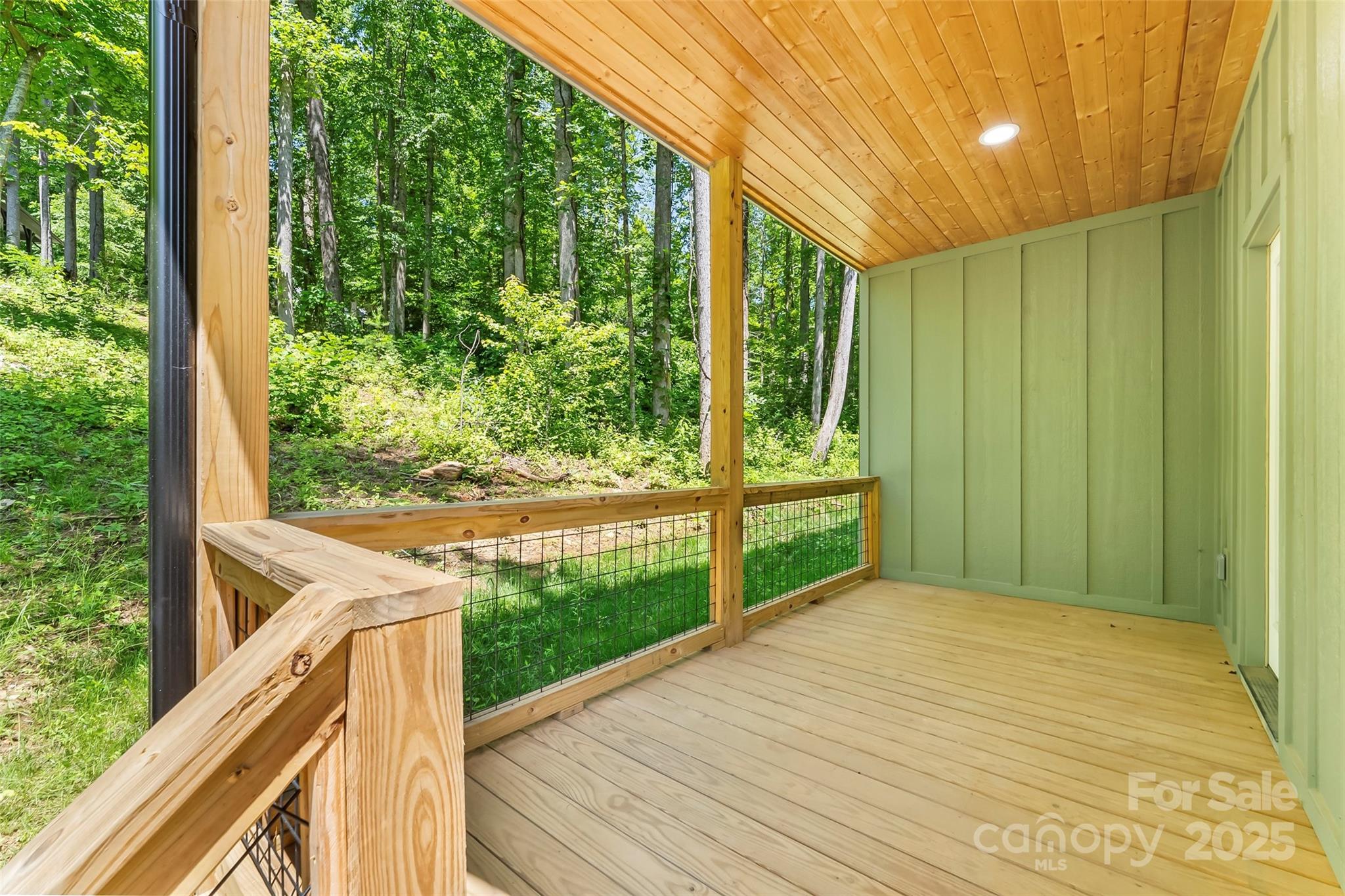 511 Blue Ridge Drive North Marion, NC 28752 - Photo 33 of 41 a balcony view with large trees and plants