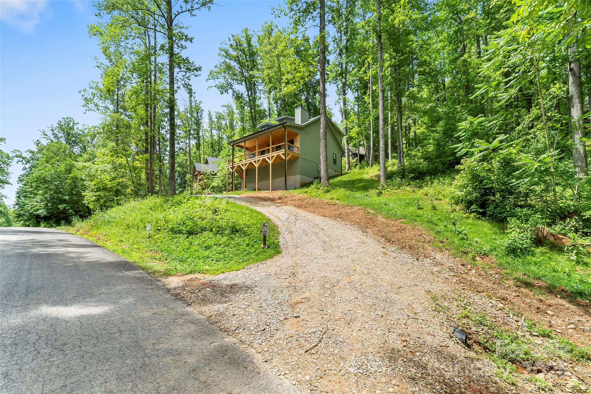 511 Blue Ridge Drive North Marion, NC 28752 - Photo 36 of 41 a front view of a house with a yard and trees