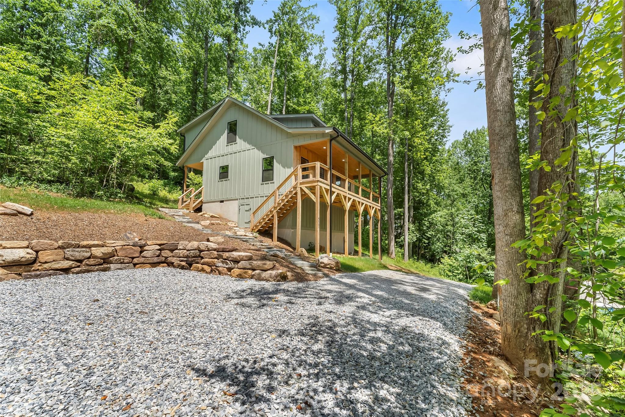 511 Blue Ridge Drive North Marion, NC 28752 - Photo 4 of 41 a front view of a house with a yard and garage