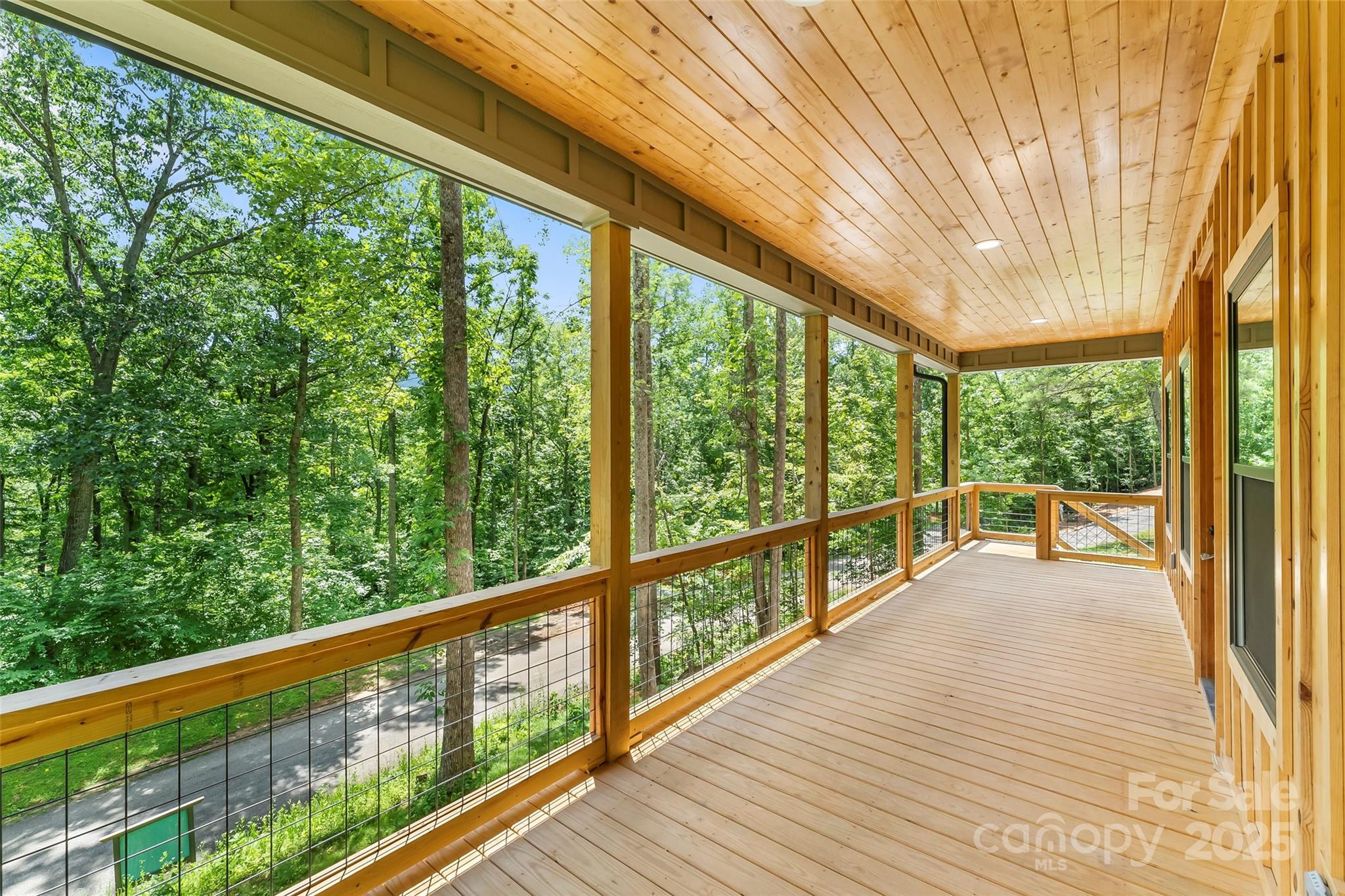 511 Blue Ridge Drive North Marion, NC 28752 - Photo 8 of 41 a view of a porch with wooden floor and outdoor seating