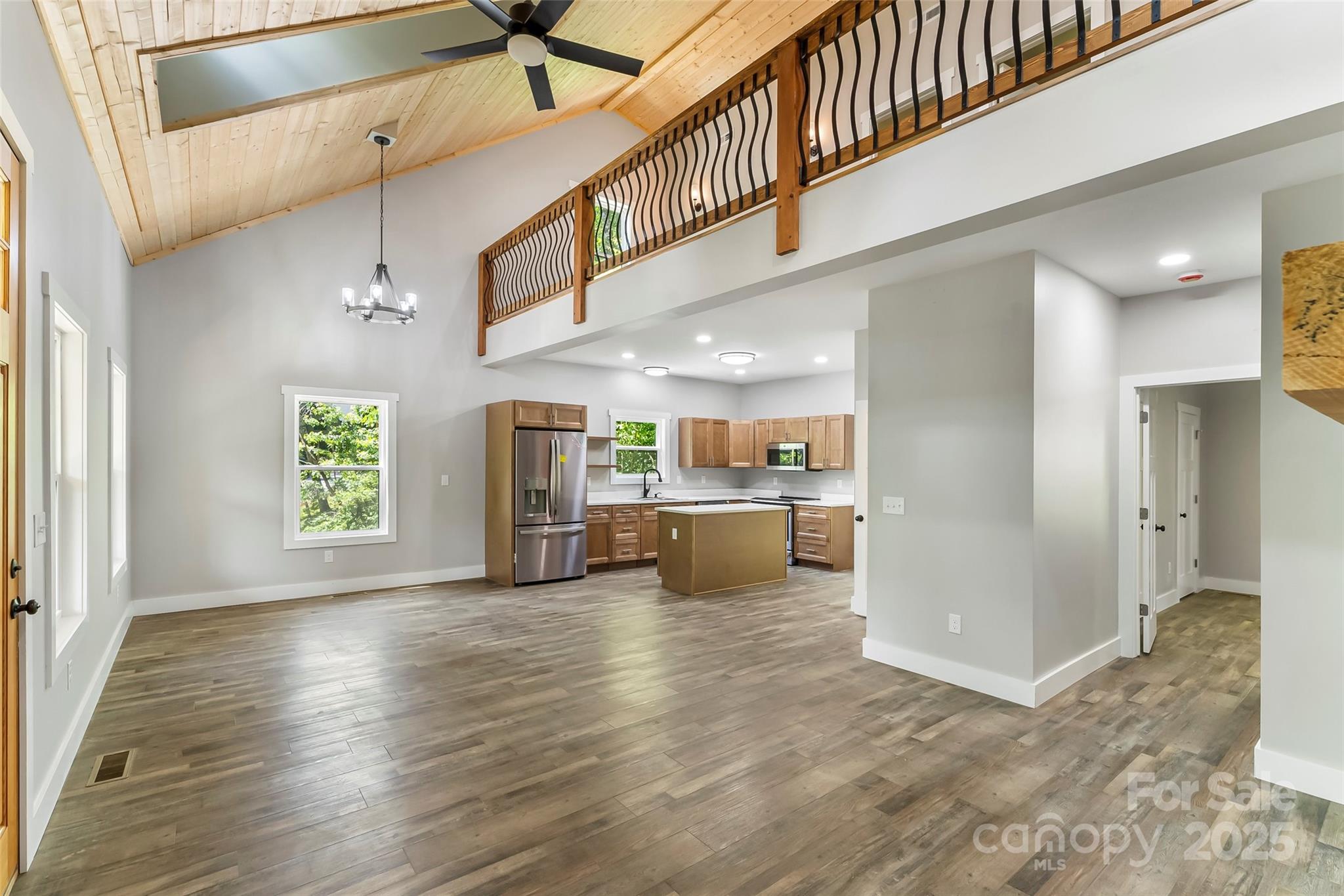 511 Blue Ridge Drive North Marion, NC 28752 - Photo 10 of 41 a view of a hallway with wooden floor and a kitchen