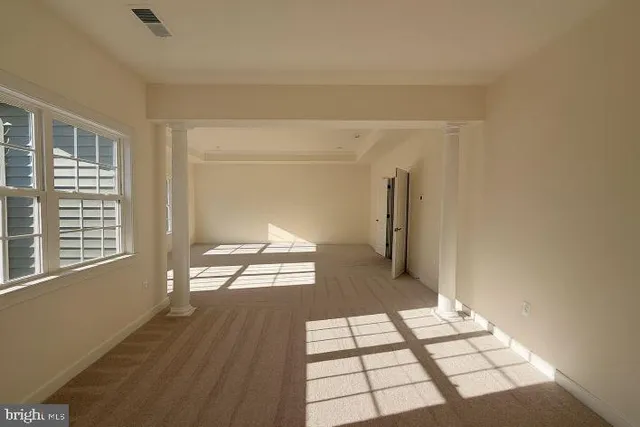a view of an empty room and window