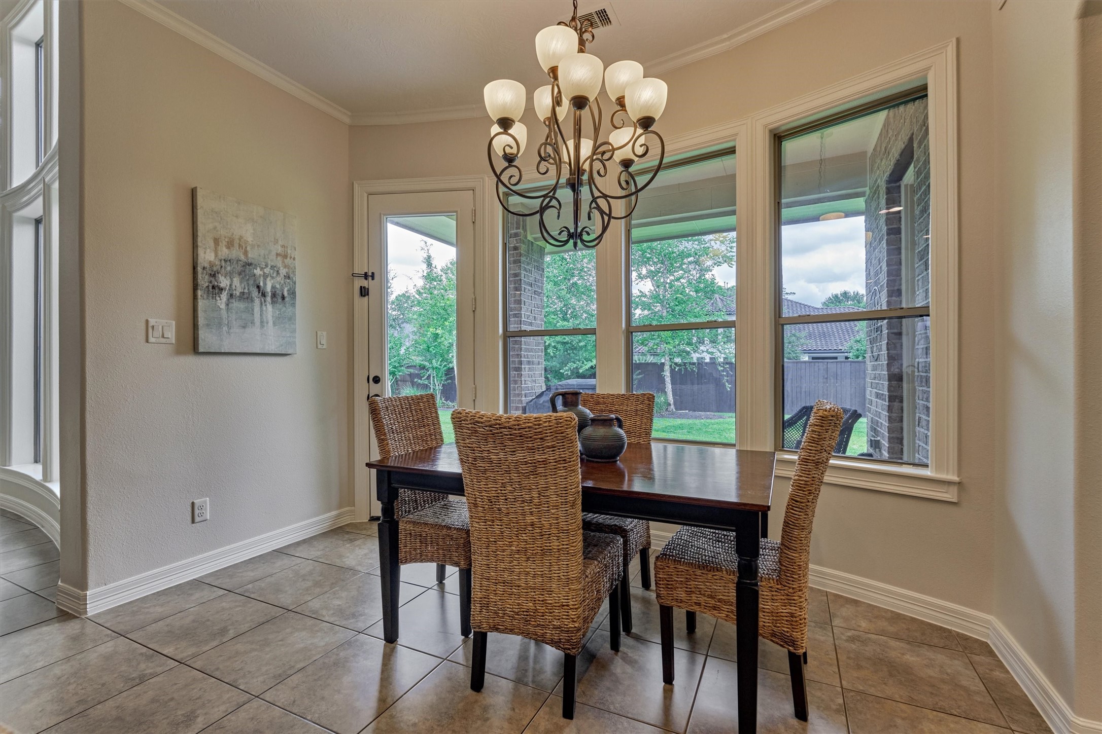 67 South Sage Sparrow Circle Spring, TX 77389 - Photo 26 of 49 a view of a dining room with furniture a chandelier and large window