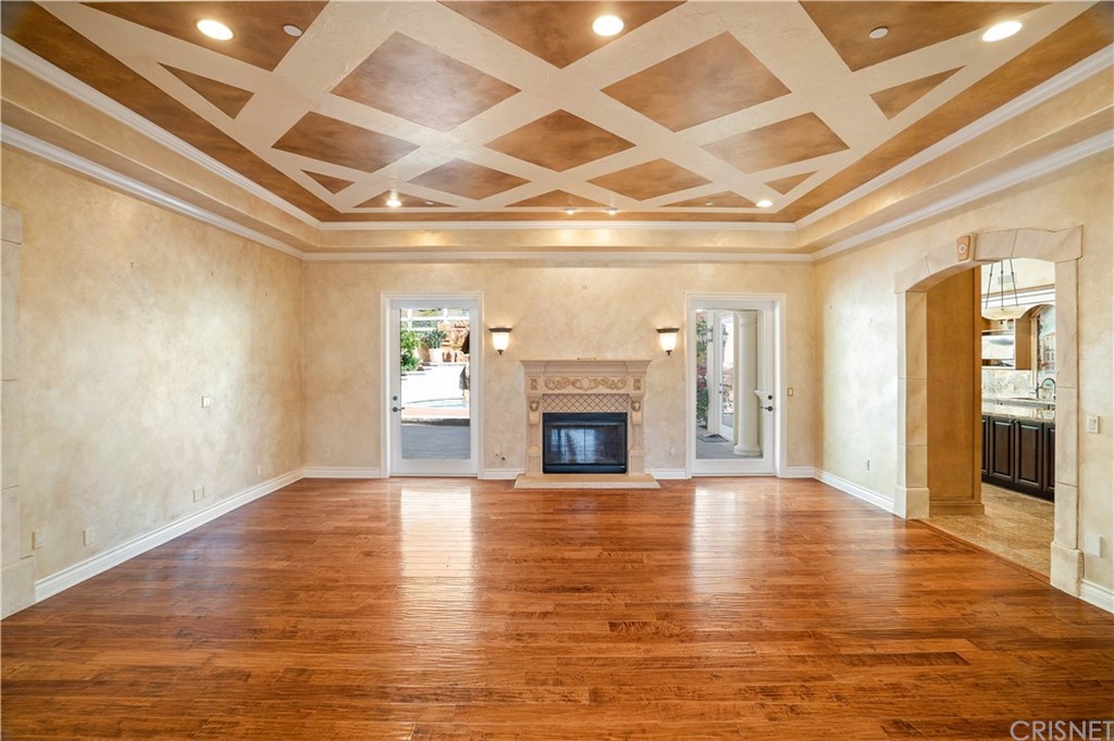 75 North Coolwater Road Bell Canyon, CA 91307 - Photo 11 of 72 a view of an empty room with wooden floor fireplace and a window