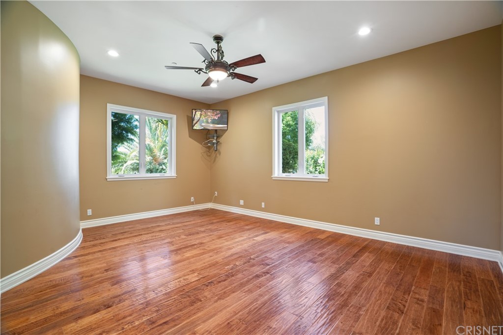 75 North Coolwater Road Bell Canyon, CA 91307 - Photo 16 of 72 a view of an empty room with wooden floor and a window