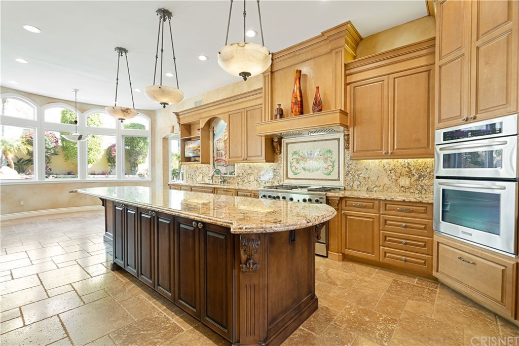 75 North Coolwater Road Bell Canyon, CA 91307 - Photo 18 of 72 a kitchen with stainless steel appliances granite countertop a stove a sink and a refrigerator