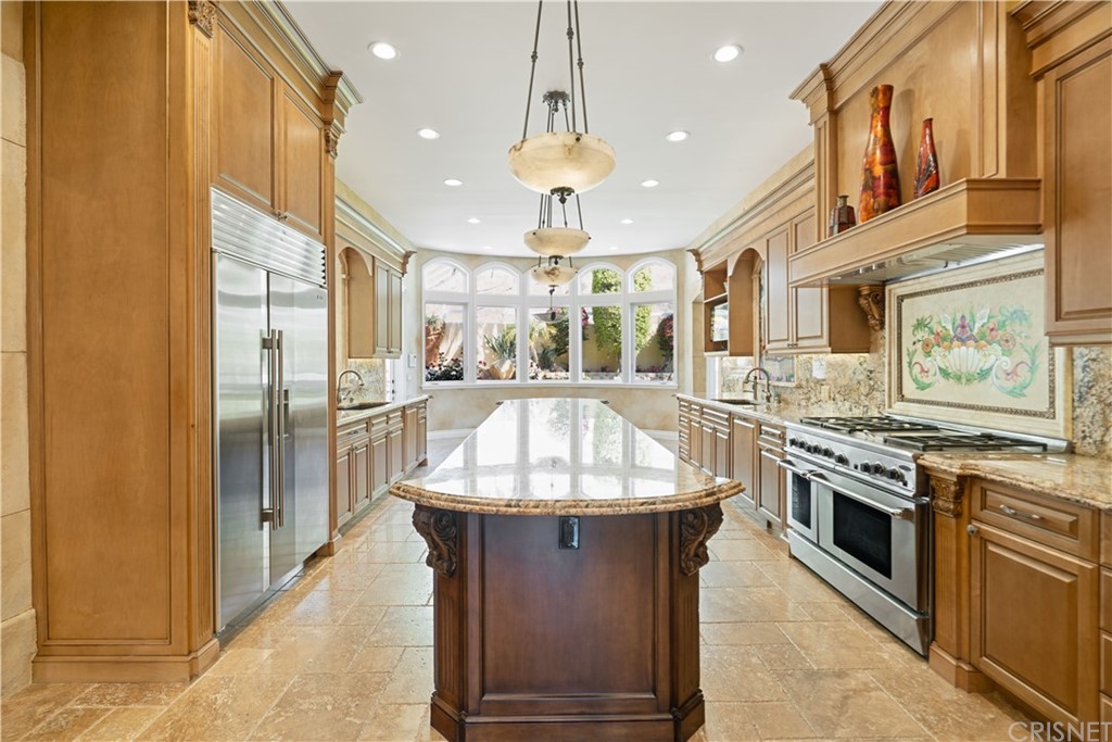 75 North Coolwater Road Bell Canyon, CA 91307 - Photo 19 of 72 a kitchen with stainless steel appliances granite countertop a stove and a refrigerator