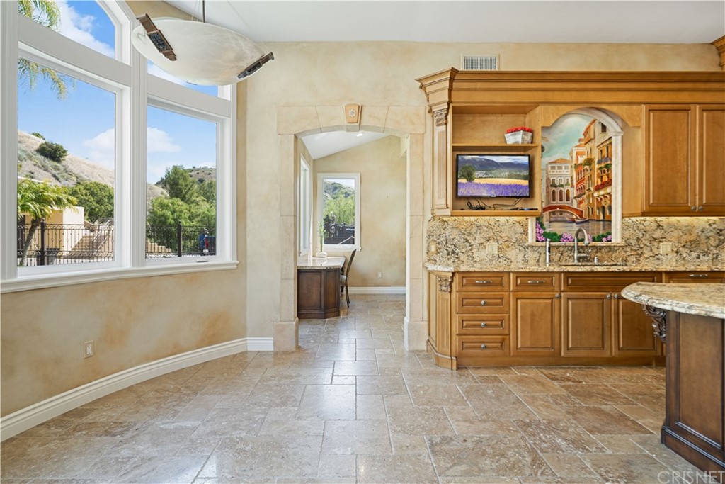 75 North Coolwater Road Bell Canyon, CA 91307 - Photo 23 of 72 a bathroom with a granite countertop sink and mirror