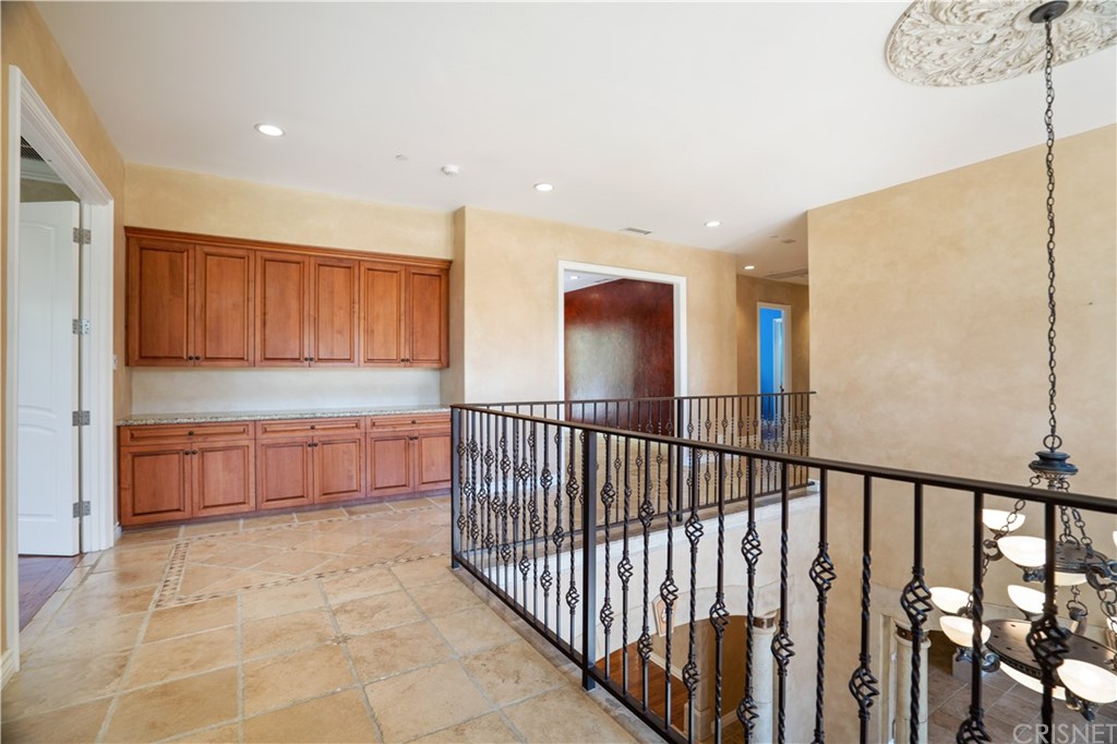 75 North Coolwater Road Bell Canyon, CA 91307 - Photo 26 of 72 a view of a hallway with a large window and wooden floor