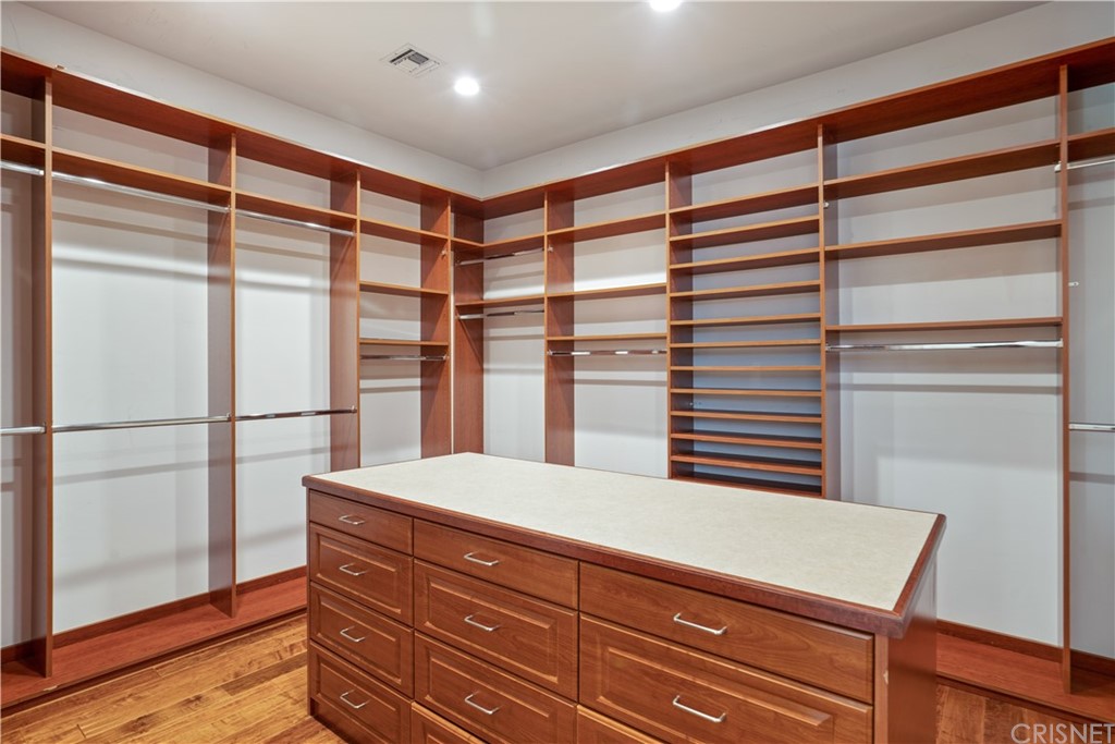75 North Coolwater Road Bell Canyon, CA 91307 - Photo 34 of 72 a hallway with a large window and kitchen area