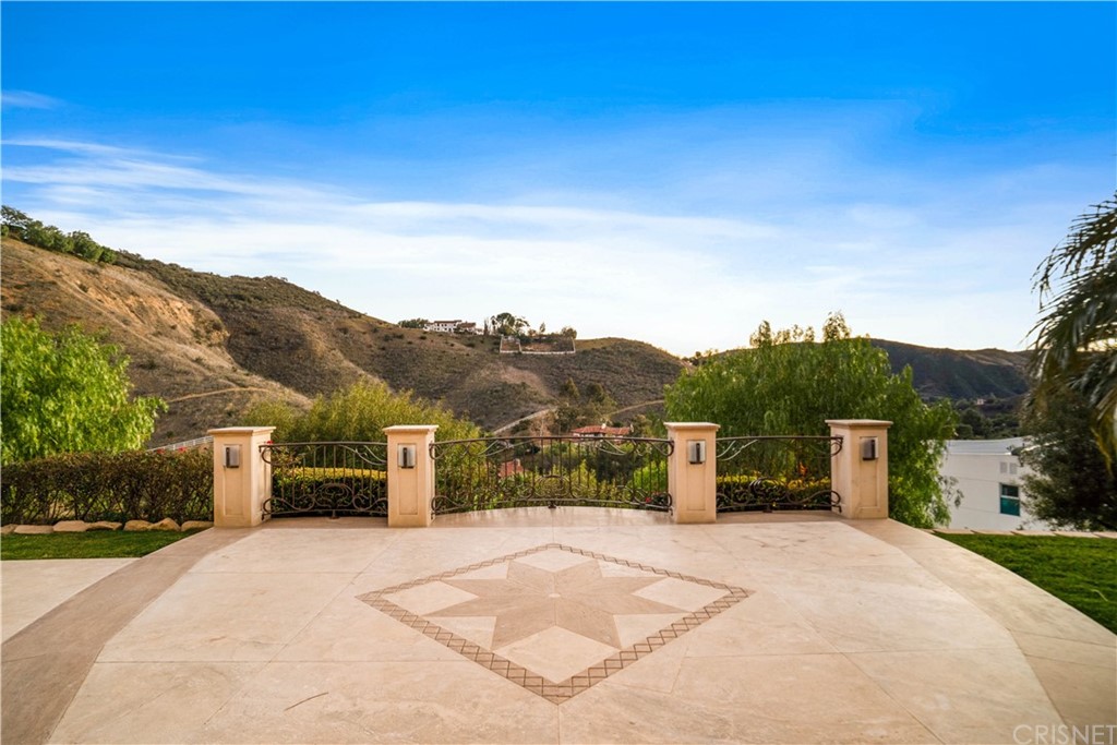 75 North Coolwater Road Bell Canyon, CA 91307 - Photo 4 of 72 a view of a terrace with a garden and mountain view