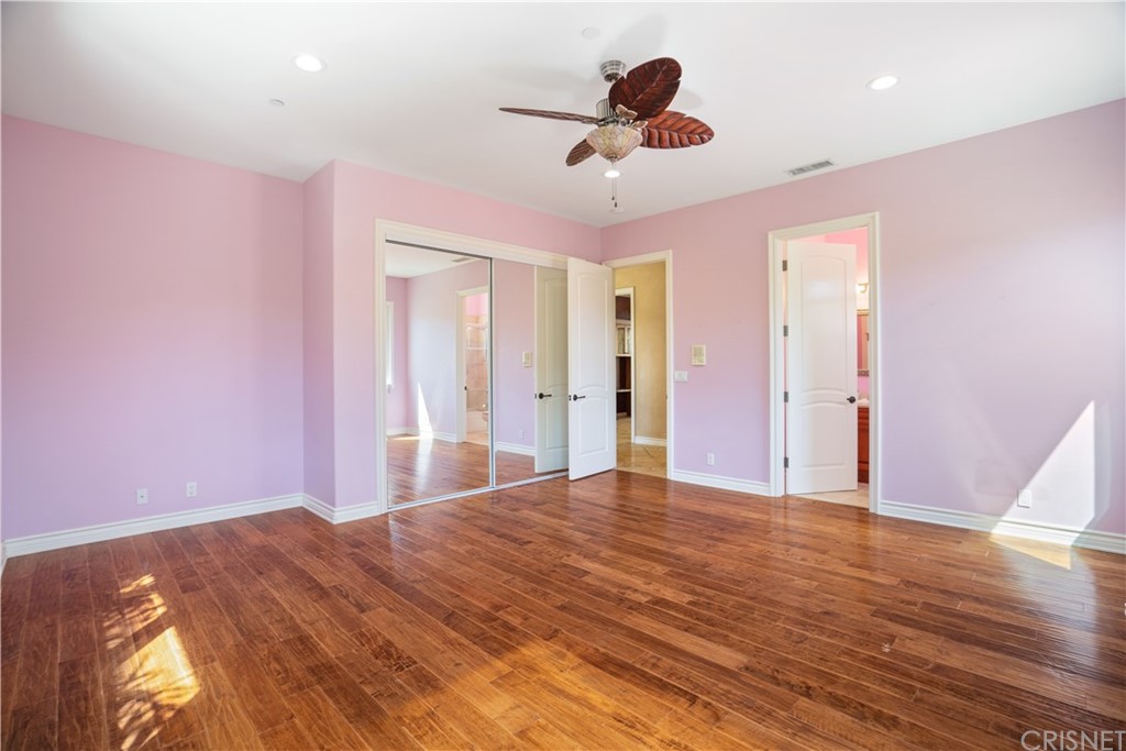 75 North Coolwater Road Bell Canyon, CA 91307 - Photo 41 of 72 a view of a livingroom with a chandelier fan and wooden floor
