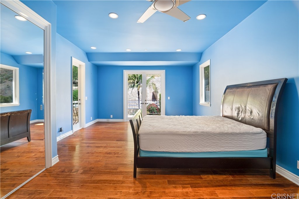 75 North Coolwater Road Bell Canyon, CA 91307 - Photo 43 of 72 a bed sitting in a spacious bedroom next to a window