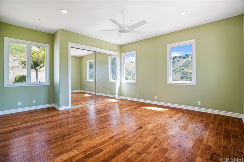 75 North Coolwater Road Bell Canyon, CA 91307 - Photo 47 of 72 a view of an empty room with wooden floor and a window
