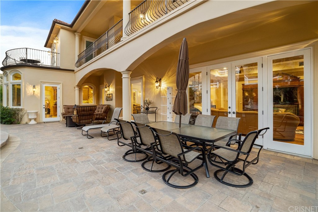 75 North Coolwater Road Bell Canyon, CA 91307 - Photo 56 of 72 a view of a dining room with furniture and chandelier