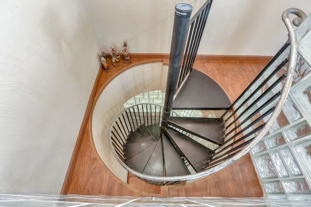 a view of staircase with wooden floor