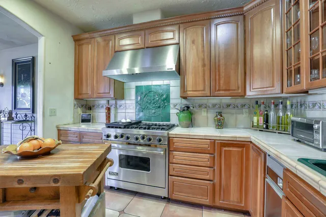 a kitchen with a stove and a sink