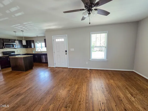 a view of kitchen and sink with wooden floor