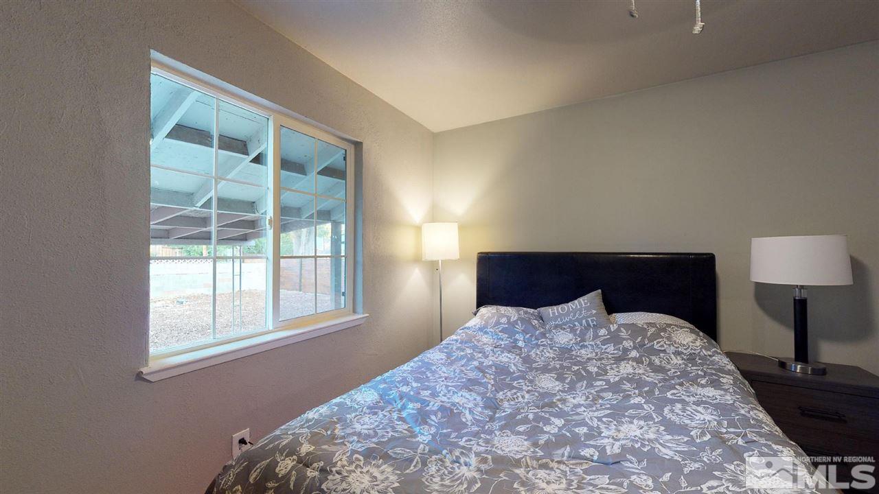 1860 Keystone Avenue Reno, NV 89503 - Photo 11 of 22 a bed sitting in a bedroom next to a window