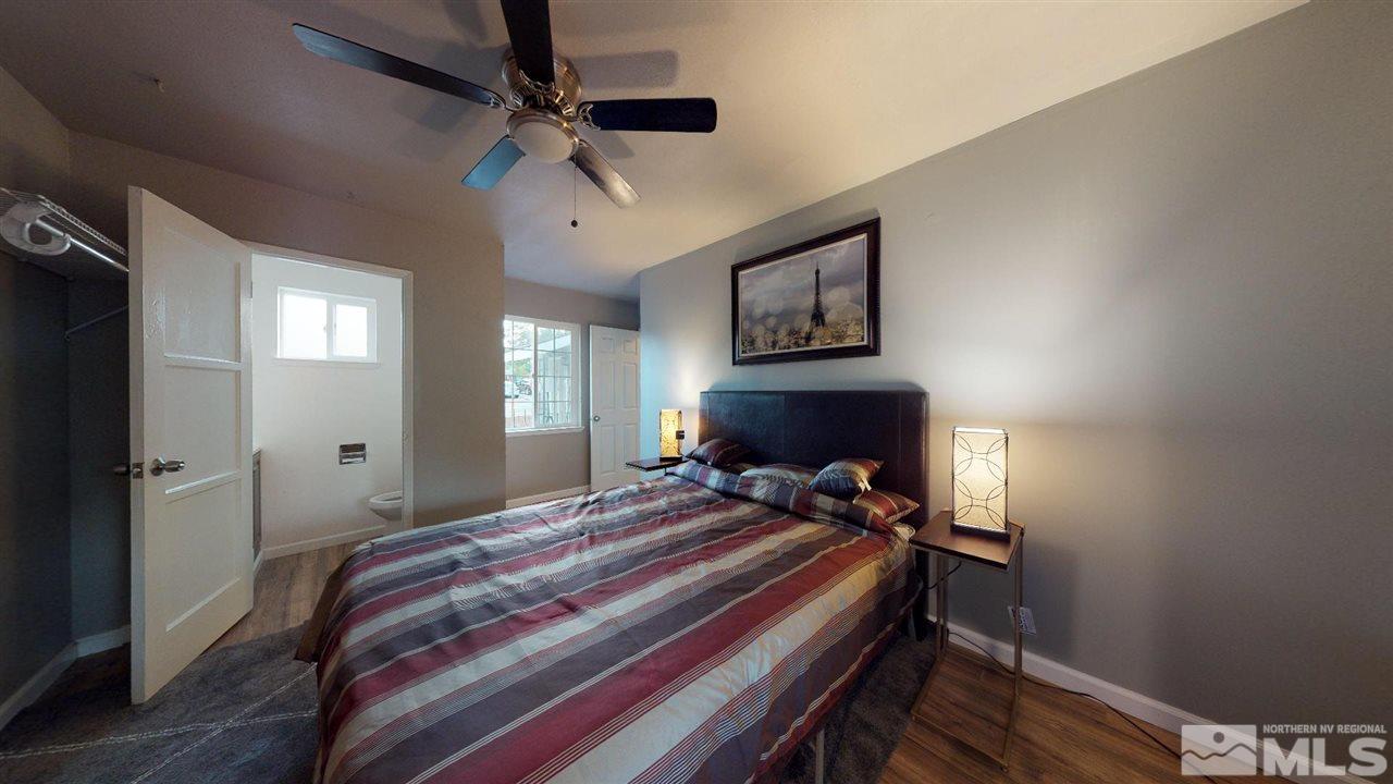 1860 Keystone Avenue Reno, NV 89503 - Photo 13 of 22 a bedroom with a bed and a chandelier