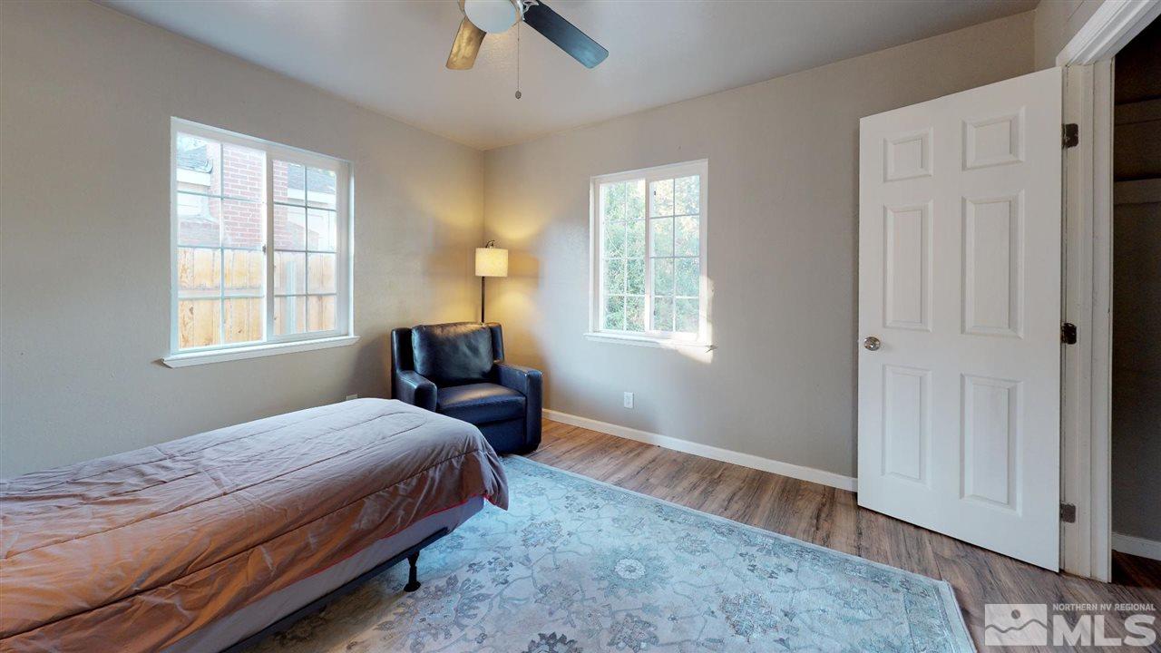 1860 Keystone Avenue Reno, NV 89503 - Photo 14 of 22 a bedroom with a bed next to a window and a chandelier