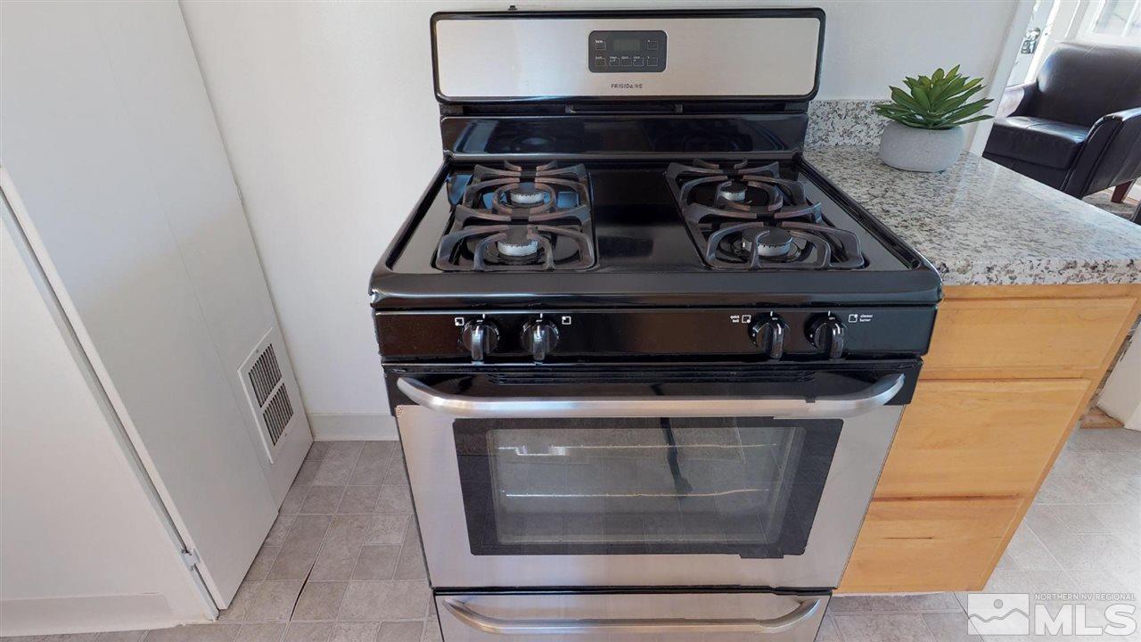 1860 Keystone Avenue Reno, NV 89503 - Photo 5 of 22 a stove top oven sitting inside of a kitchen