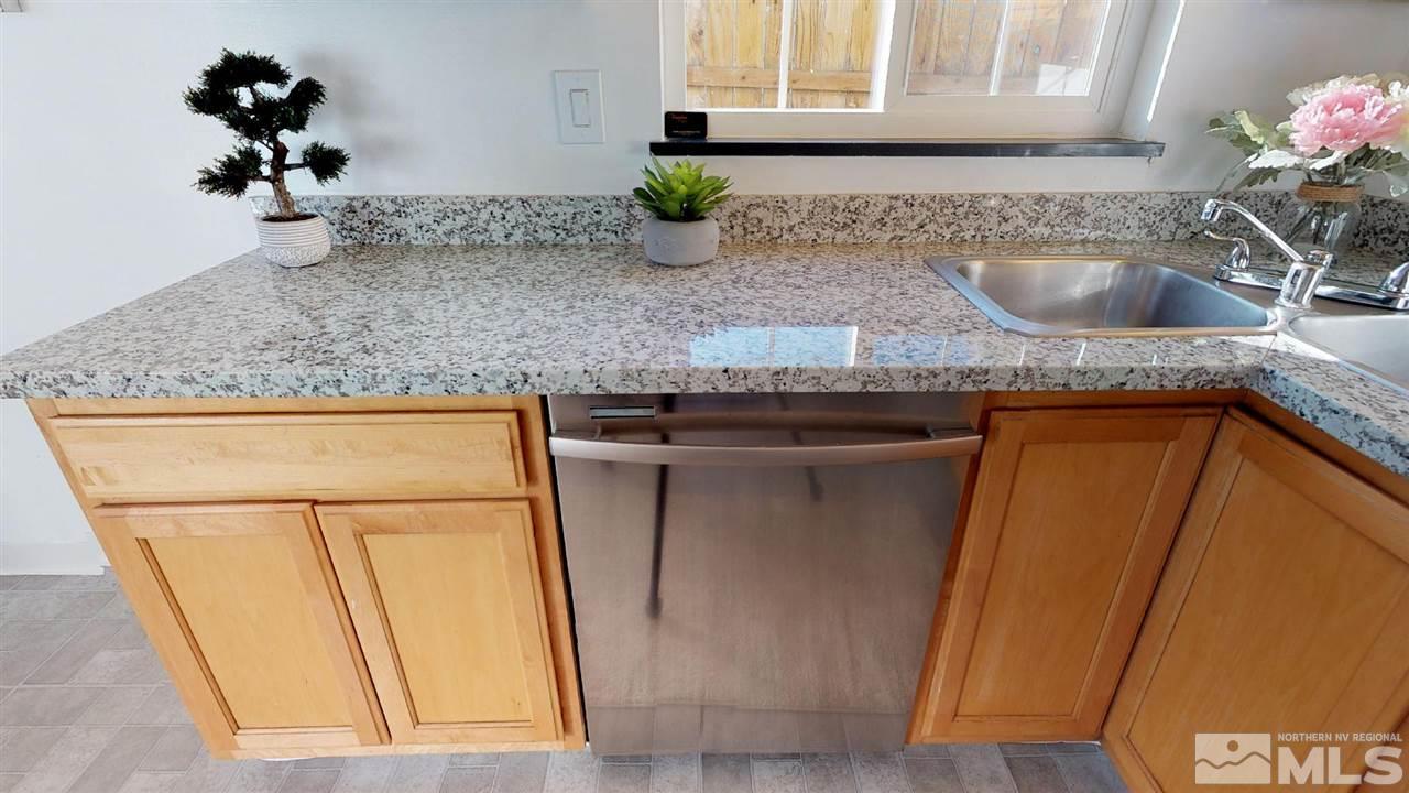 1860 Keystone Avenue Reno, NV 89503 - Photo 6 of 22 a kitchen with a sink and a refrigerator