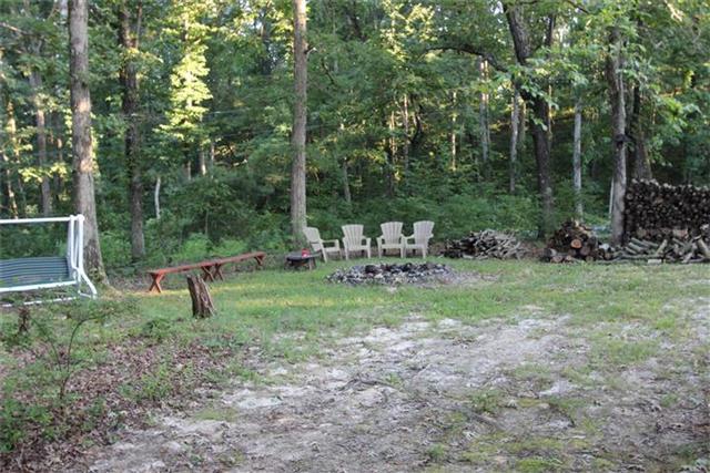 2474 Cypress Road Buchanan, TN 38222 - Photo 3 of 20 Large sitting area & fire pit in the back lawn.