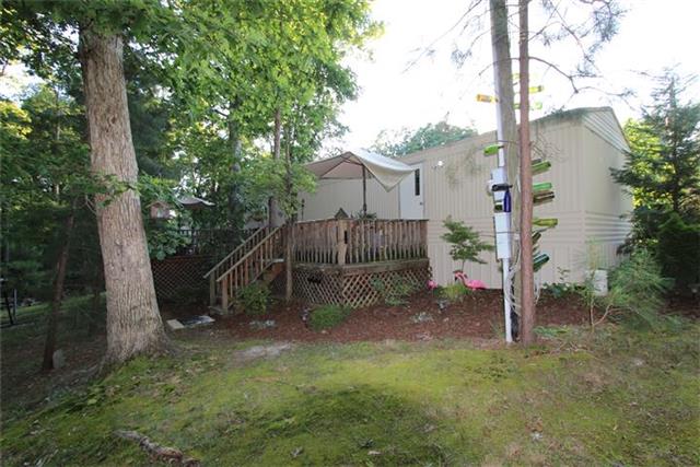 2474 Cypress Road Buchanan, TN 38222 - Photo 5 of 20 Back view of home with deck across the back.