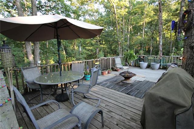2474 Cypress Road Buchanan, TN 38222 - Photo 7 of 20 Custom fire pit on the deck. Great size for entertaining.