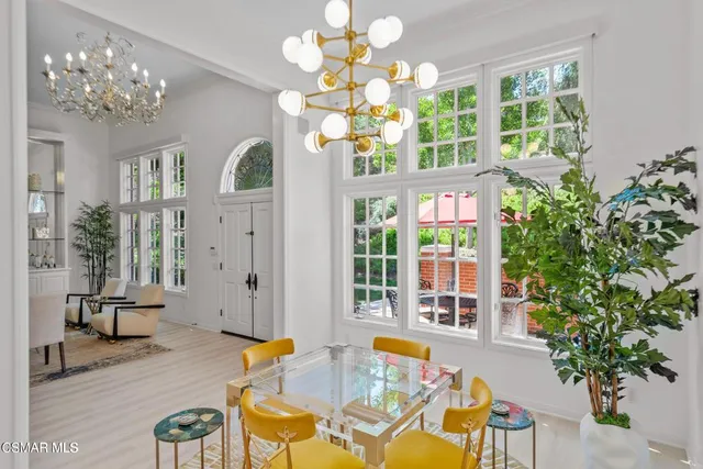 a living room filled with furniture chandelier and a chandelier