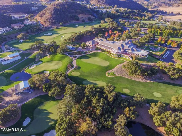 a view of a patio with swimming pool and mountains