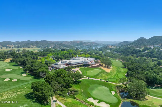 an aerial view of residential houses and city street
