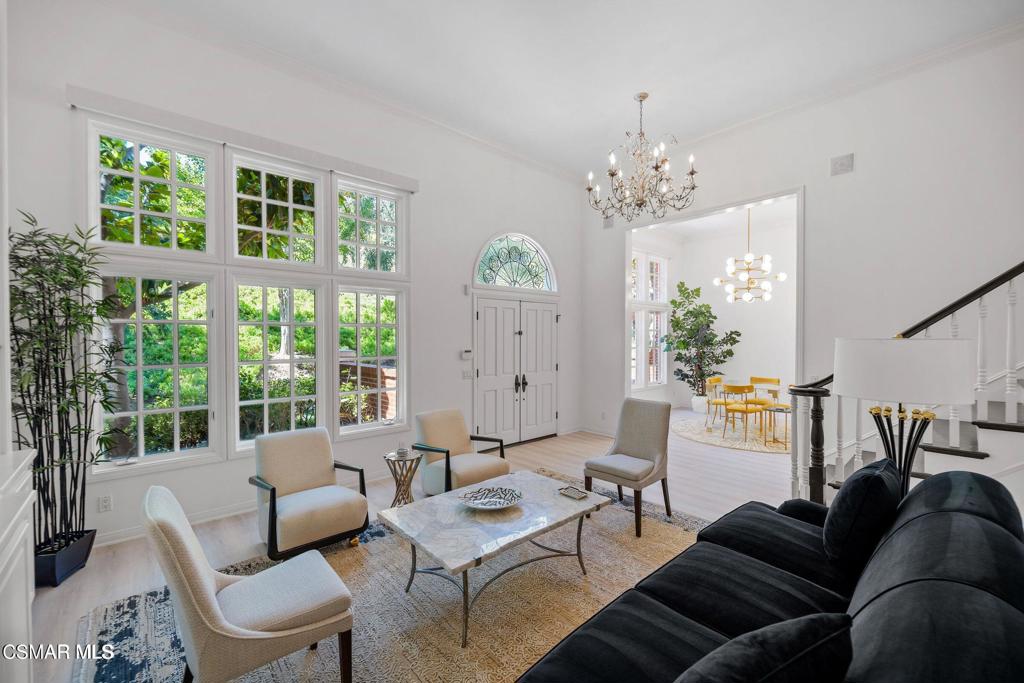 2479 Swanfield Court Lake Sherwood, CA 91361 - Photo 7 of 15 a living room with furniture a chandelier and a window