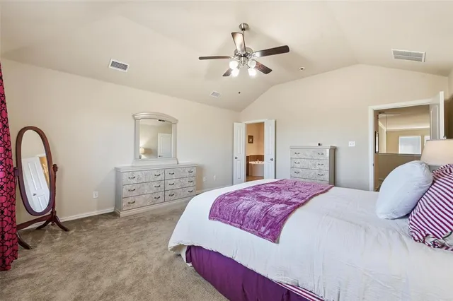 a bathroom with a tub a double vanity sink and mirror