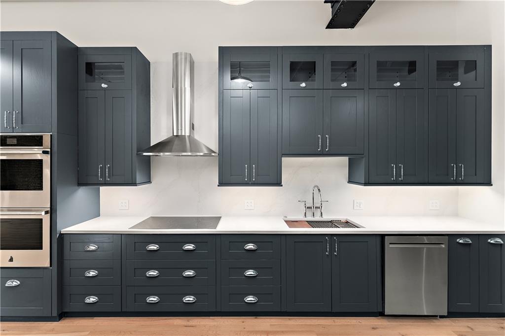 915 Liberty Avenue, Unit 701 Pittsburgh, PA 15222 - Photo 14 of 50 a bathroom with a sink double vanity and a mirror