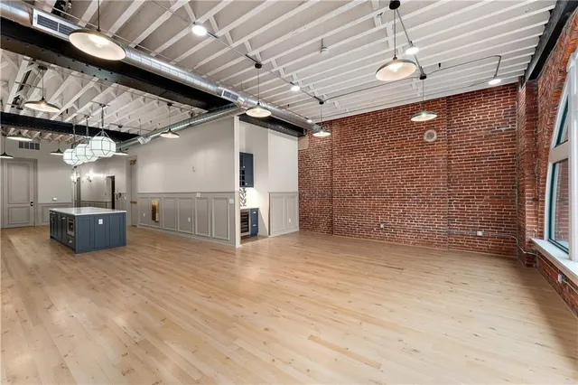 a view of an empty room with a fireplace