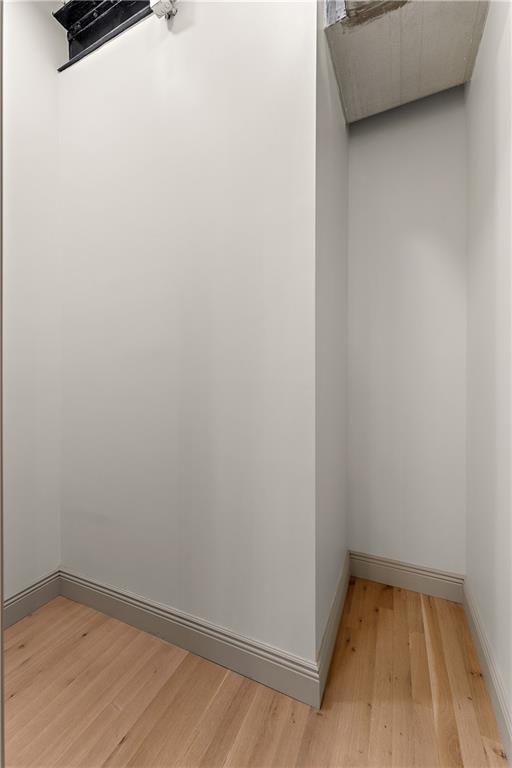 915 Liberty Avenue, Unit 701 Pittsburgh, PA 15222 - Photo 28 of 50 a view of a room with wooden floor and white walls