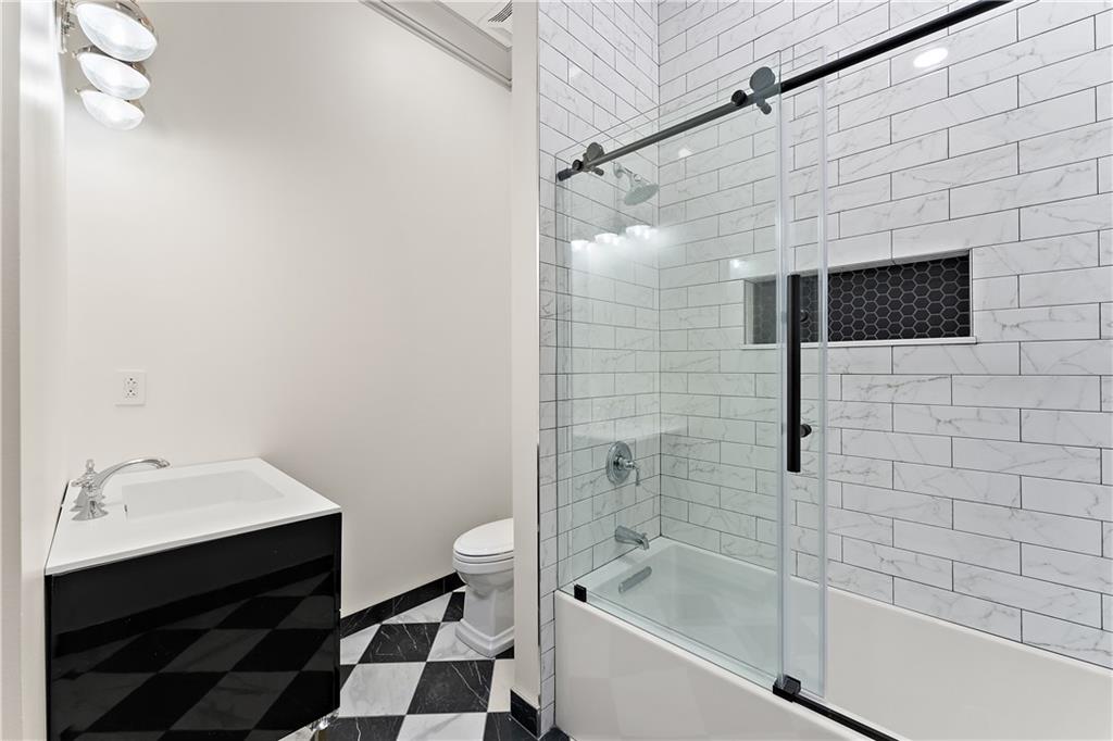 915 Liberty Avenue, Unit 701 Pittsburgh, PA 15222 - Photo 32 of 50 a bathroom with a bathtub and a shower