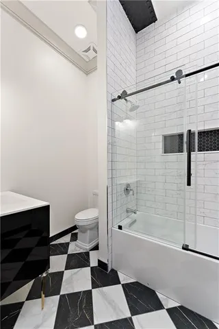 a bathroom with a bathtub and a shower