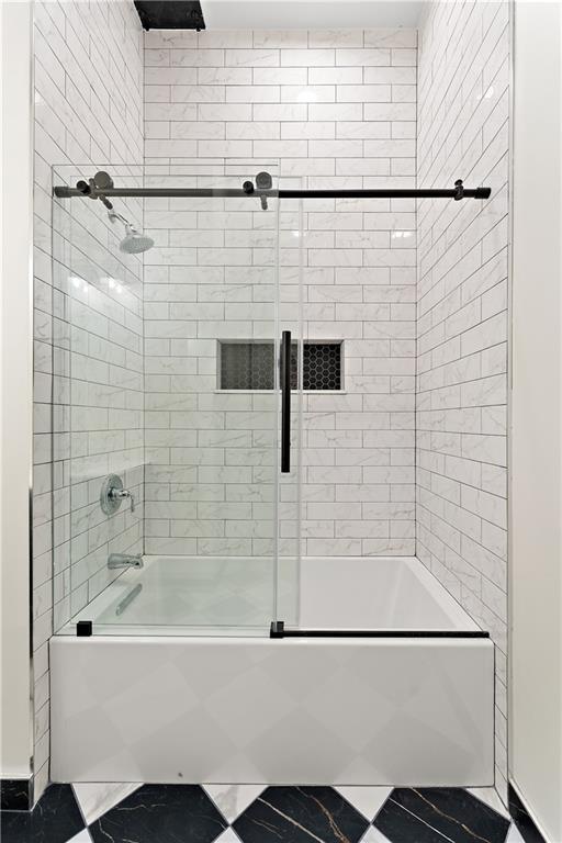 915 Liberty Avenue, Unit 701 Pittsburgh, PA 15222 - Photo 34 of 50 a bathroom with a bathtub and a shower