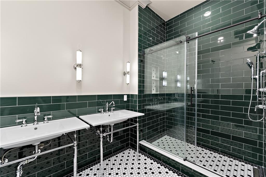 915 Liberty Avenue, Unit 701 Pittsburgh, PA 15222 - Photo 42 of 50 a bathroom with a sink a toilet and shower