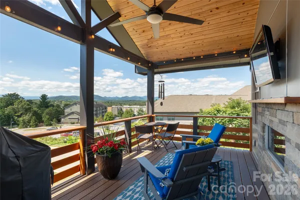 a view of a balcony with furniture