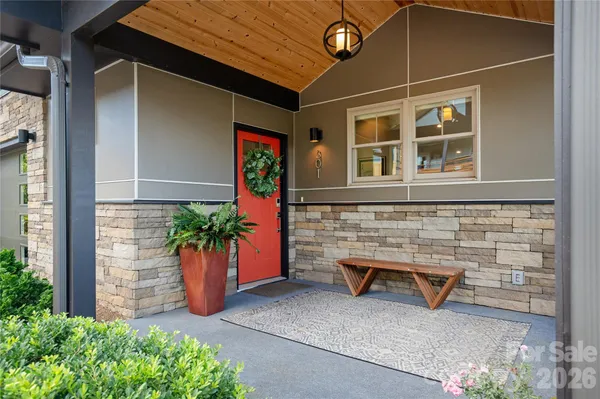 a couple of potted plants in front of door