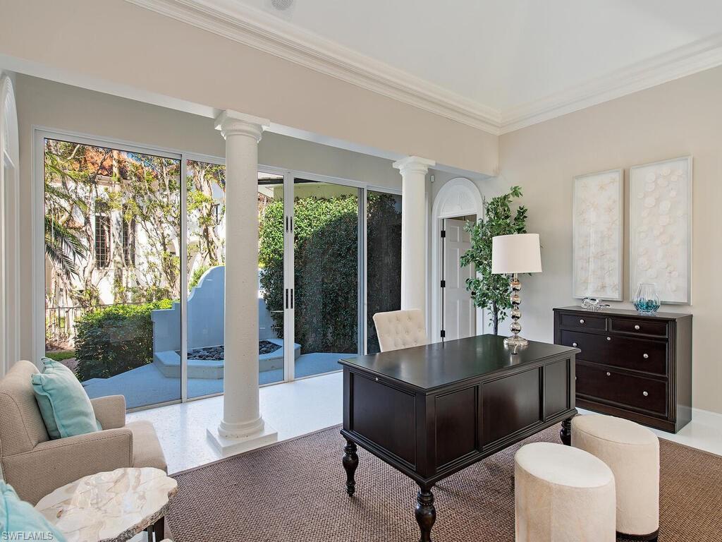 3630 Rum Row Naples, FL 34102 - Photo 16 of 28 a living room with furniture and a large window