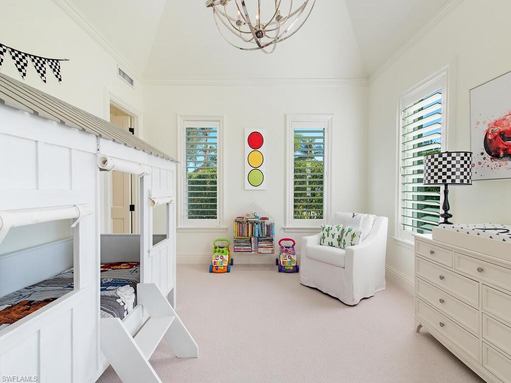 3630 Rum Row Naples, FL 34102 - Photo 21 of 28 a bedroom with furniture and a flat screen tv