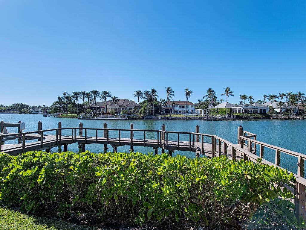 3630 Rum Row Naples, FL 34102 - Photo 26 of 28 a view of a chairs and table on the terrace