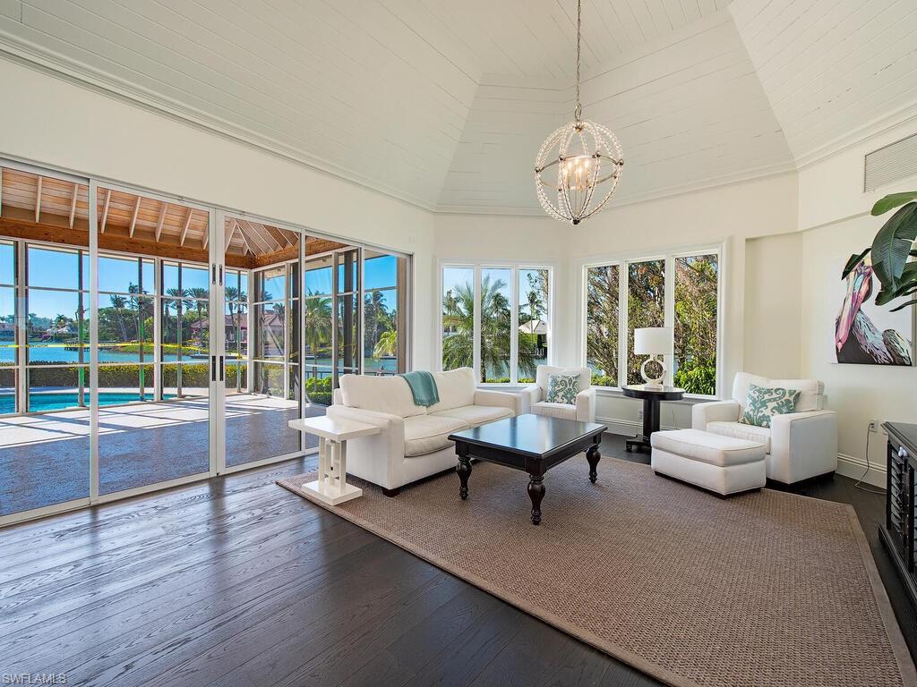 3630 Rum Row Naples, FL 34102 - Photo 7 of 28 a living room with furniture and a large window